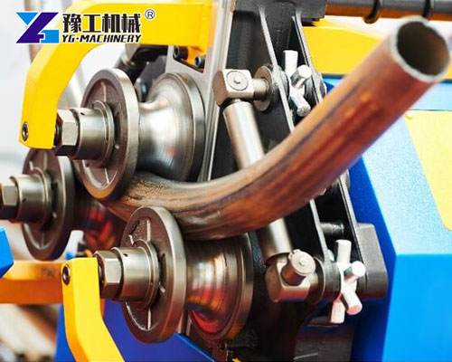 Automatic pipe bender shaping metal tubing