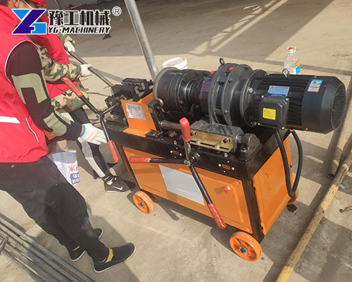 Factory worker operating thread roller