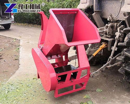 Farm tractor with wood chipping attachment