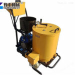 Hand-pushed road repair machine