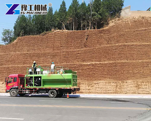 Hydroseeding machine spraying green slope