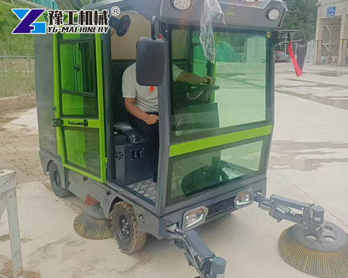 Industrial street cleaning vehicle working