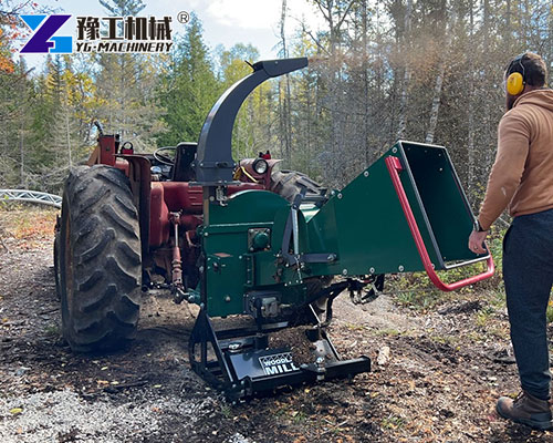 PTO chipper processing thick branches
