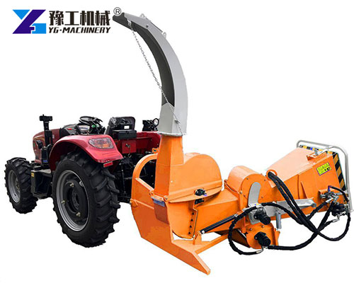 PTO wood chipper attached to tractor