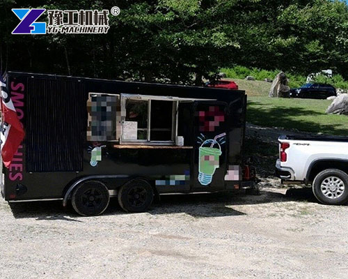 Solar-powered smoothie trailer near beach