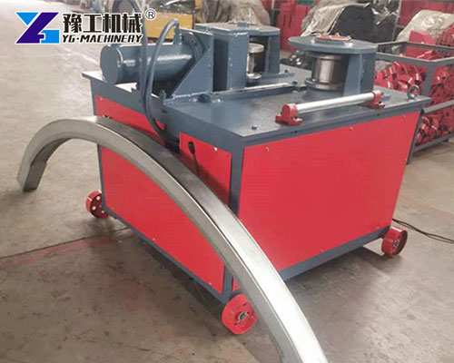 Steel tube bender in manufacturing workshop