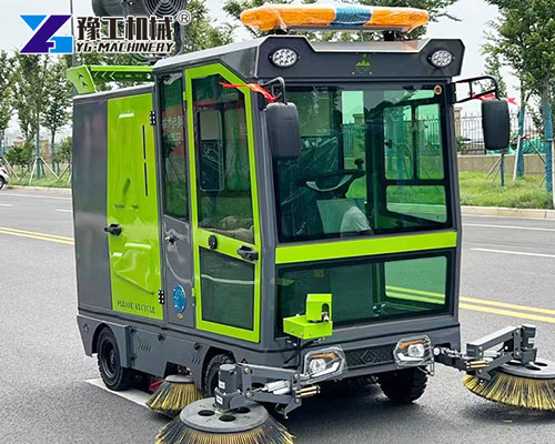 Street sweeper with rotating brushes