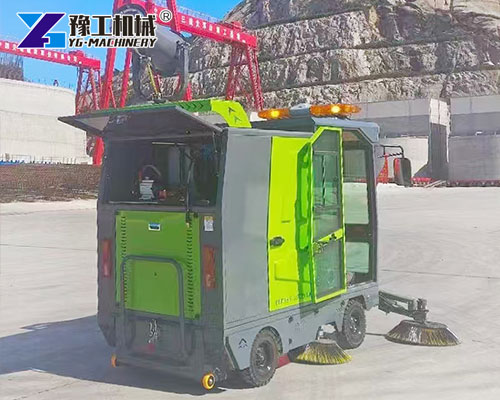 Street sweeper with water spray system