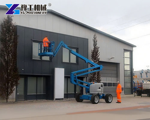 Articulated cherry picker in use at shopping mall