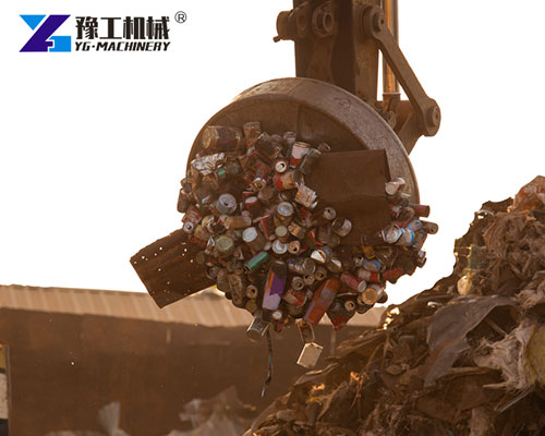 Excavator scrap metal magnet in recycling yard
