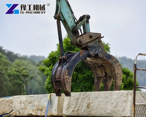 Excavator stone grab moving granite blocks