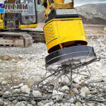 Hydraulic excavator magnet handling scrap metal