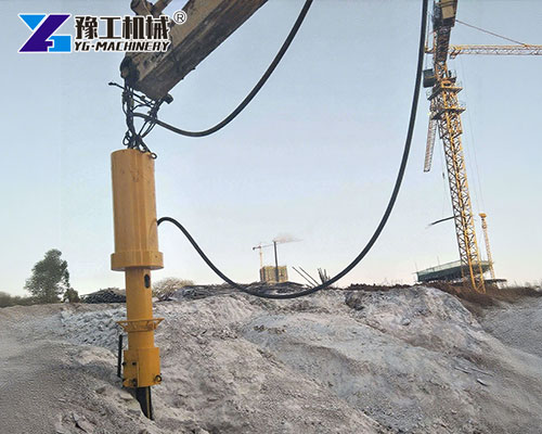 Rock splitter installed on excavator in railway repair