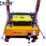 Automatic plaster machine on jobsite wall