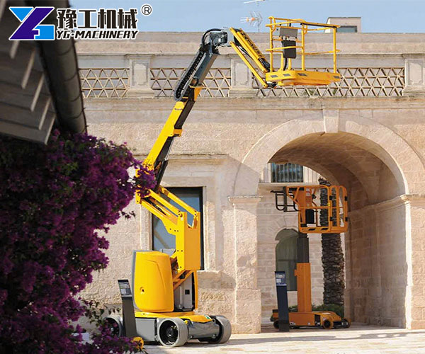 Electric articulating boom lift working outdoors