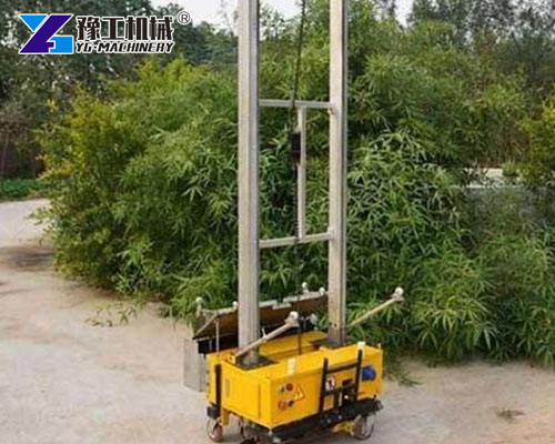 Plaster machine mounted on construction scaffold
