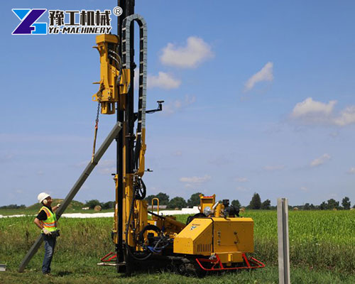 Solar ground pile driver working on site
