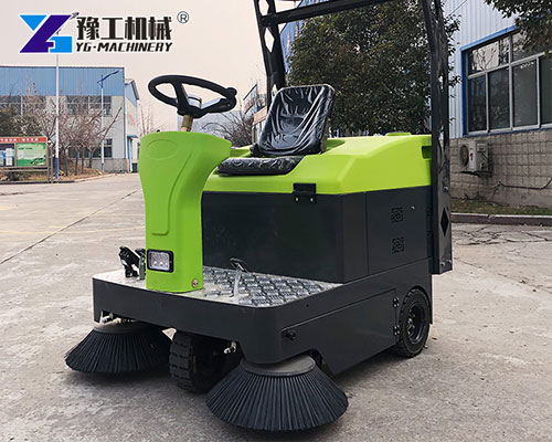 Warehouse floor sweeper removing dust and debris