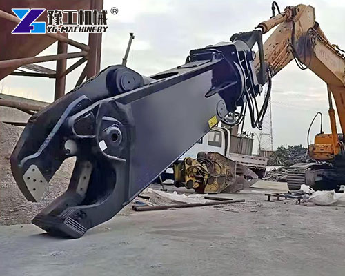 Excavator hydraulic cutter cutting metal beams