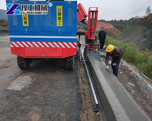 Slipform curb machine paving city road