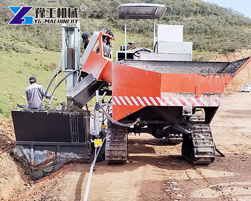 Workers operating YG slipform curb machine efficiently