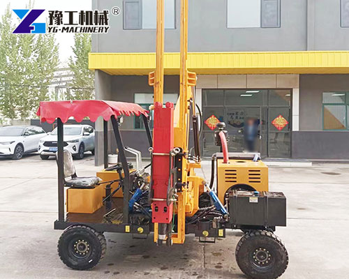 Road barrier pile driver in outdoor construction area