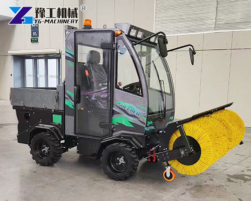 snow sweeper machine clearing road