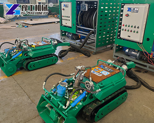 Industrial robot removing sediment from tank