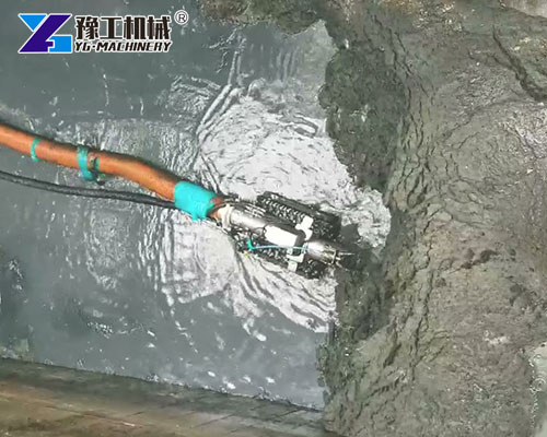 Industrial tank cleaning robot removing sludge
